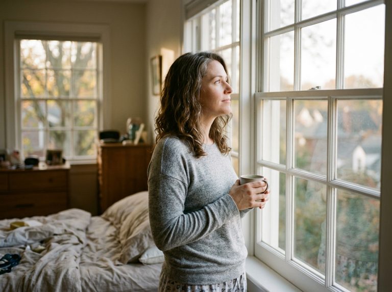 woman contemplating by morning window